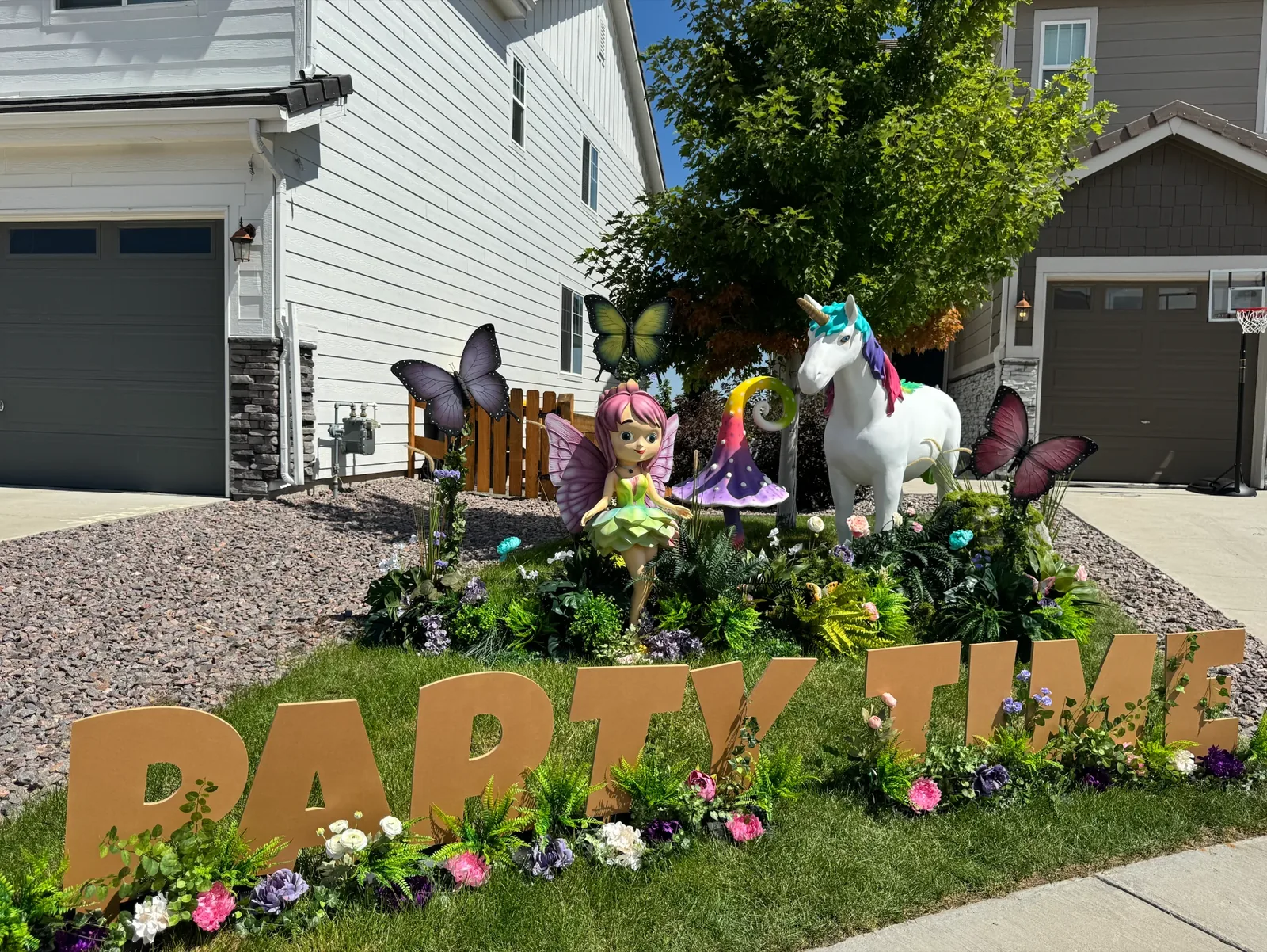 Enchanted Garden Legend package in daylight — full yard display with personalized letters